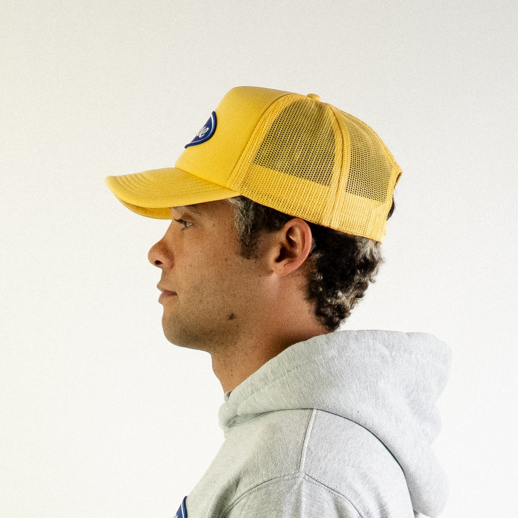 Blue Oval Patch Trucker Hat (Yellow)